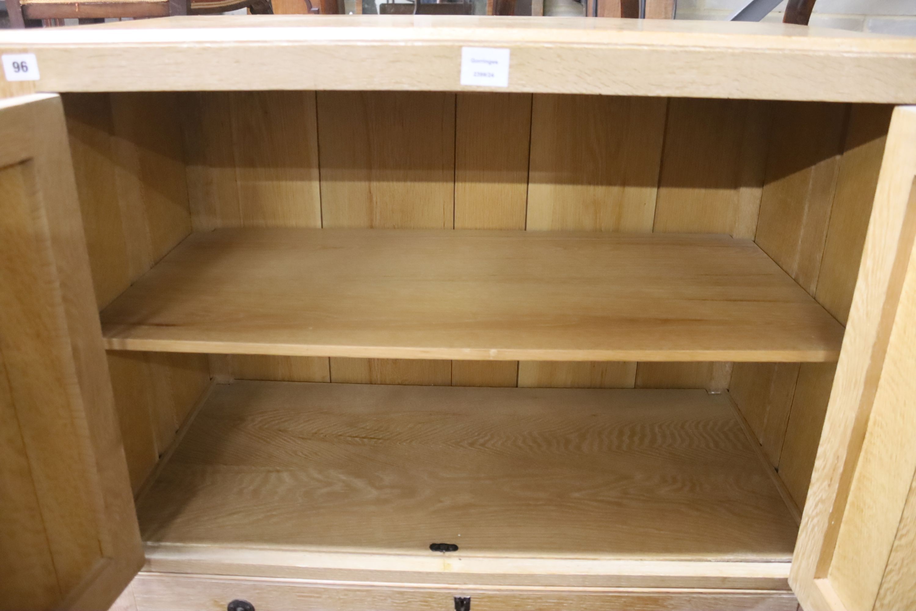 A 1930's bleached oak four drawer cabinet, width 90cm, depth 46cm, height 137cm